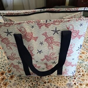 Insulated cooler zip bag with lobster and starfish.